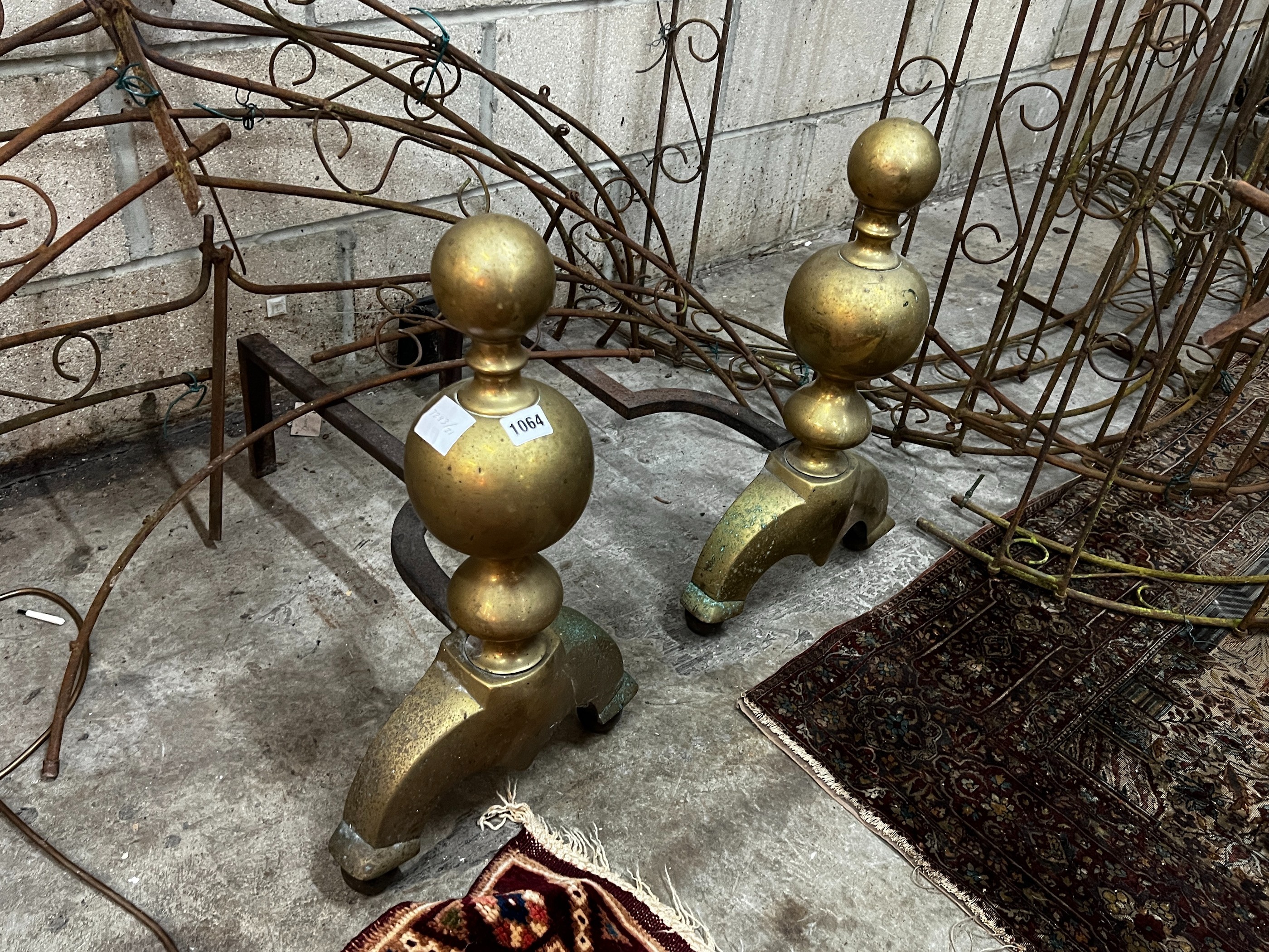A pair of large 17th century style brass and wrought iron fire dogs, height 56cm